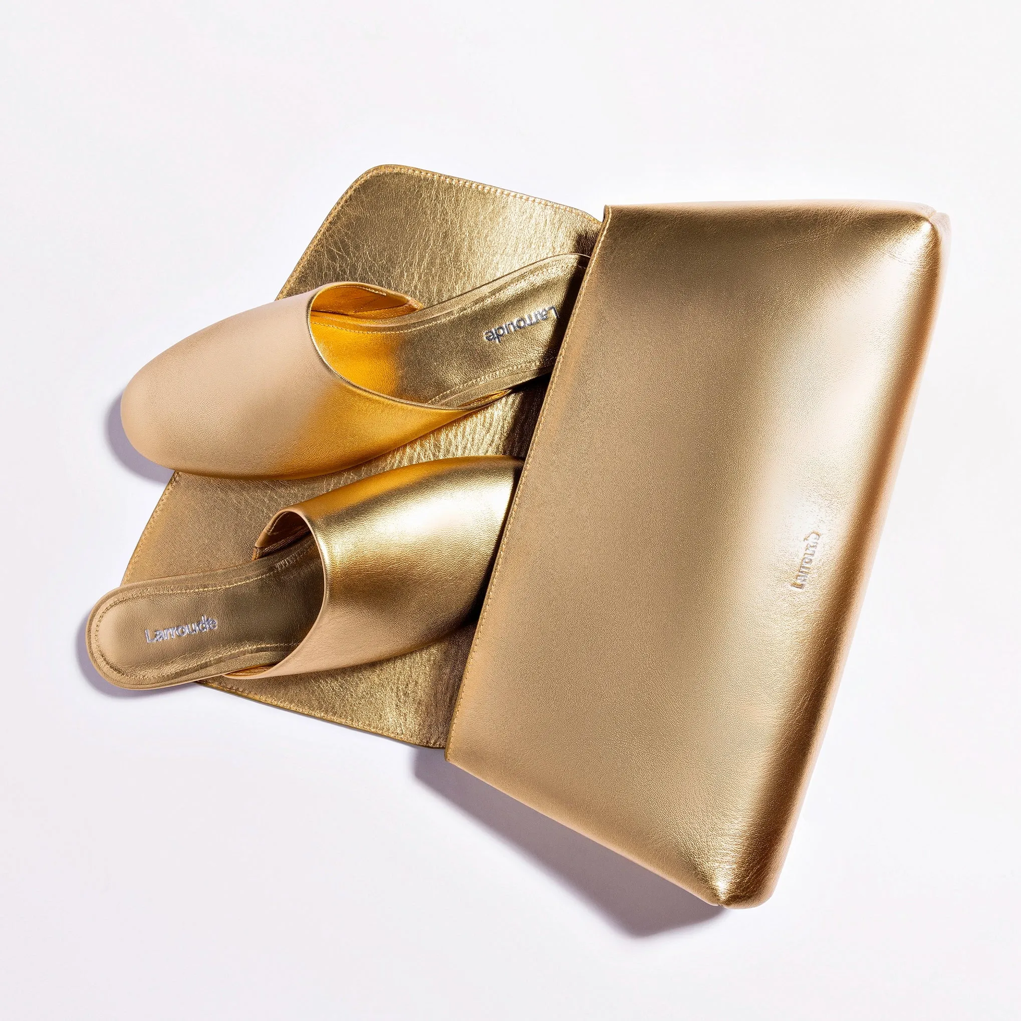 Larroude Venice Flat Mule and Pouch Kit In Gold Metallic Leather